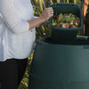 Image of Green Johanna Close Up of Person Pouring Food Scraps Into The Top