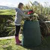 Image of Person in garden with Green Johanna compost bin and plants