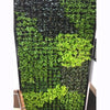 Image of green wall with a mix of green and black plants on a white background