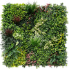 Image of Artificial evergreen rainforest green wall panel with various types of plants on a white background