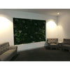 Image of Artificial Green Forest Vertical Garden Panel Installed Indoors with a couch and 2 chairs on carpet