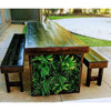 Image of Green Tropics Artificial Plant Wall Panel built into a wooden outdoor dining table with benches