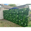 Image of Artificial White Tropics Vertical Garden Wall Panel installed in a residential backyard setting