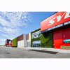 Image of Sydney tools store exterior with gro wall slim pro green wall facade and 'Best Brands' sign against a blue sky.