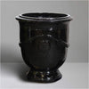 Image of Black ceramic urn on a gray background