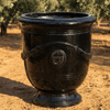 Image of black glazed french anduze urn outdoors on gravel