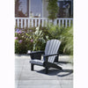 Image of Graphite Adirondack chair on a patio with plants and flowers in the background
