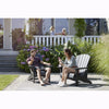Image of Two people sitting on Adirondack chairs in a garden setting.
