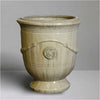 Image of Decorative sand french ceramic urn with decorative elements on a grey background