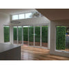 Image of An image of a modern home with glass bi-fold doors opening to a courtyard enclosed by the Artificial Spring Sensation Hedge Wall Panels