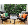 Image of Wild Tropics Artificial Vertical Garden Panel featured on a patio with a table and chair setting