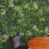 Image of Artificial Lush Forest Panel Installed With A Table and Chair in foreground