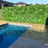 Image of Artificial White Tropics Vertical Garden Wall Panel installed by a pool