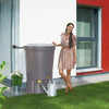 Image of Woman standing next to a Lanzarote rain barrel outside a modern house

