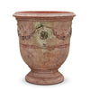 Image of Terracotta pot with decorative patterns on a white background