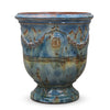 Image of Blue ceramic planter with decorative patterns on a white background