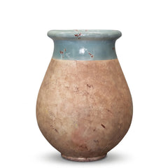 Celadon glazed French Biot jar with antiqued terracotta base on white background