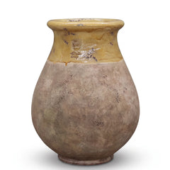 Aged Honey glazed French Biot jar with antiqued terracotta base on white background