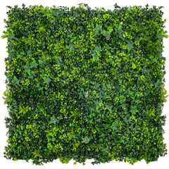 Artificial spring sensation green wall panel on a white background