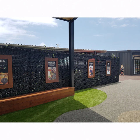 facade panels in restaurant with signage installed on them.