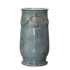 Decorative ceramic vase with textured surface on a white background