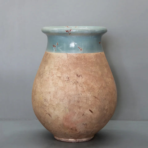 Ceramic vase with a two-tone design on a gray background