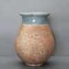 Image of Ceramic vase with a two-tone design on a gray background