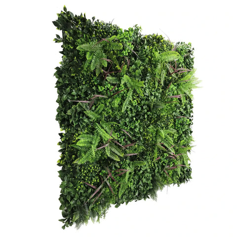 side angle view of artificial green wall panel with various greenery on a white background