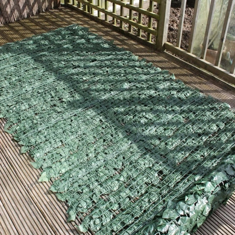 Actual image showing the backing frame of the Artificial Ivy Leaf Hedge Screen laid flat on a wooden surface