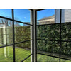 Image of View out a window towards the Artificial Vertical Garden of Eden Installed in the Garden on a fence