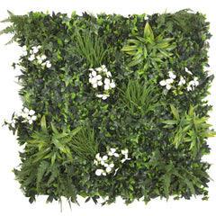 Artificial white tropicsgreen wall with various plants and white flowers on a white background