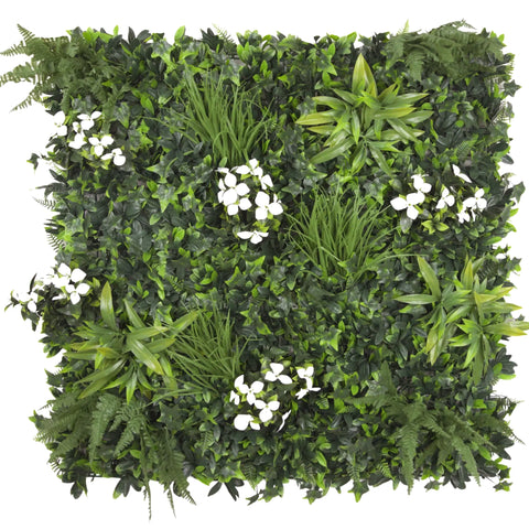 Artificial white tropics green wall with various plants and white flowers on a white background