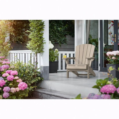 silver sage adirondack chair on a porch with flowers and plants around