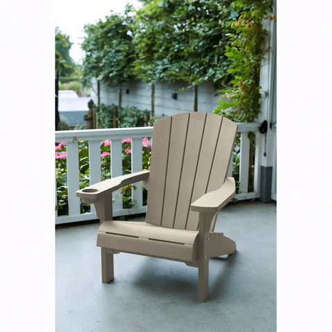 Beige Adirondack chair on a porch with greenery in the background