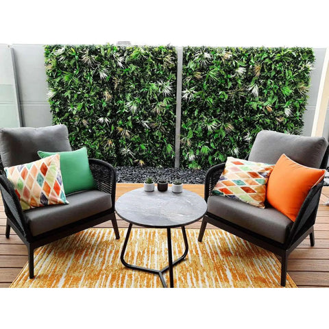 Wild Tropics Artificial Vertical Garden Panel featured on a patio with a table and chair setting
